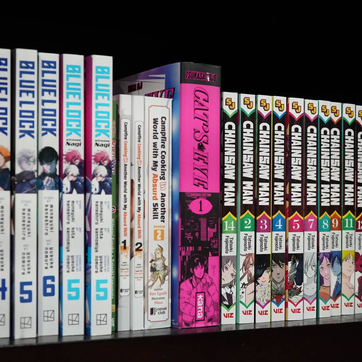 Bookshelf with manga aincluding Blue Lock and Chainsaw Man